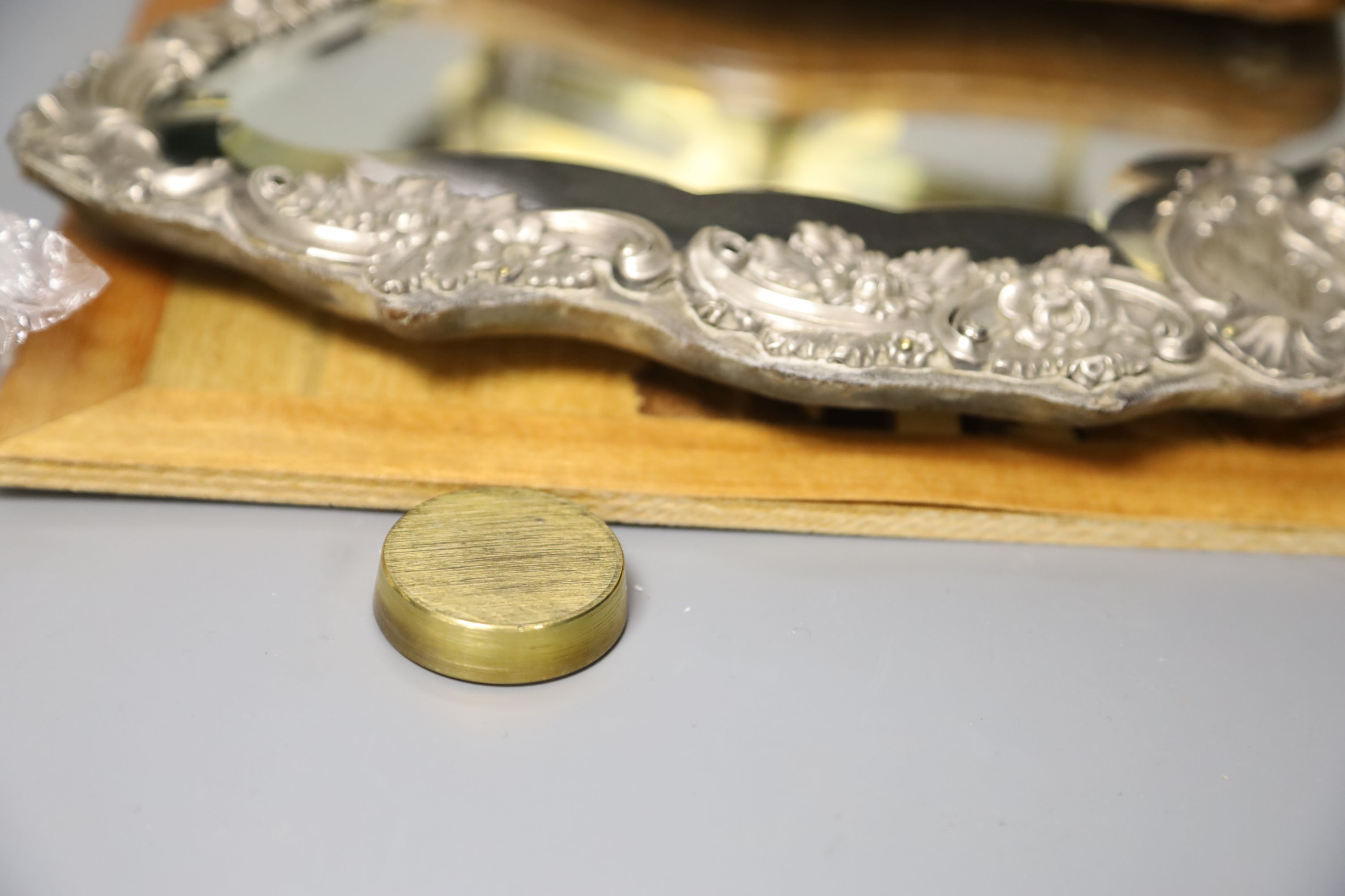 A set of postal scales, a white metal overlaid easel mirror, length 36.5cm, and a carved wood panel